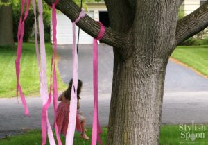 pink princess party tree swing with pink streamers