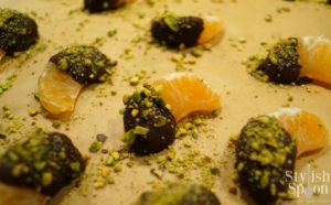 Chocolate covered clementines with pistachios