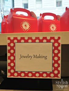 I made signs that I posted around the salon with the different activities (jewelry making, nail coloring, manicures and pedicures). I made the signs in Word using a hot pink polka dot background that I found online, added a white rectangle and text box in the middle.